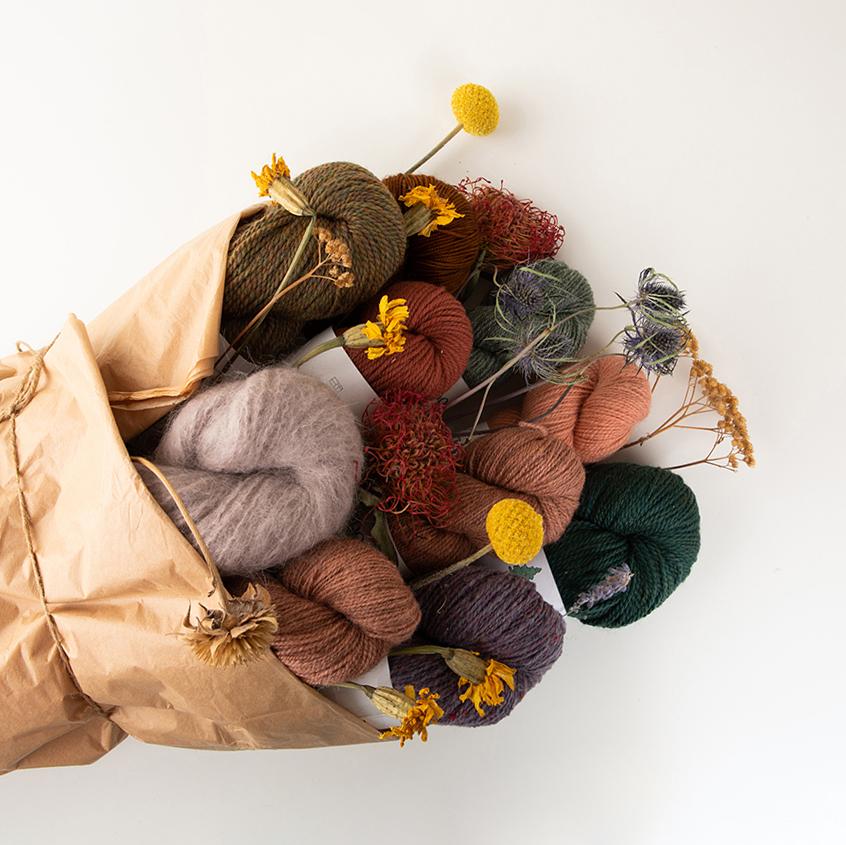 This is an ecommerce picture of fancy yarn in a bouquet