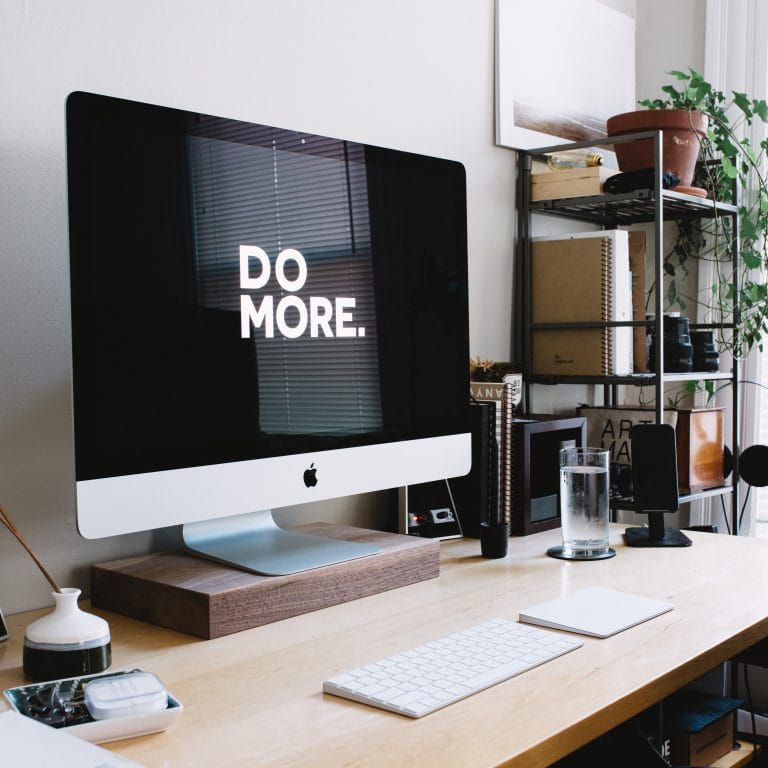 A computer set up with the screen saying "Do More".