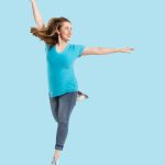 Dance Company Photoshoot with Rocky Mountain Rhythm featuring a dancer doing a jump in blue.