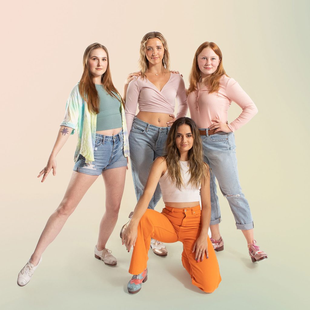 Dance Company Photoshoot with Rocky Mountain Rhythm featuring a group of young women posed in colorful tap shoes.