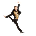 Dance Company Photoshoot with Rocky Mountain Rhythm showing a dancer in gold and black leaping on a white background.