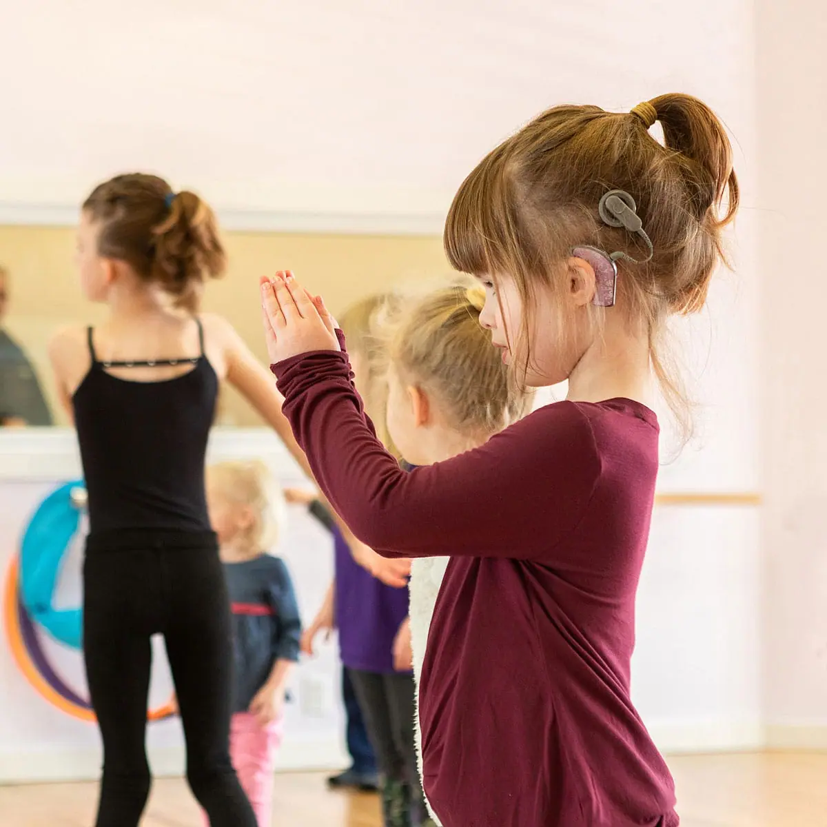 Dance studio branding photoshoot with Feel the Beat featuring deaf dancers in class.