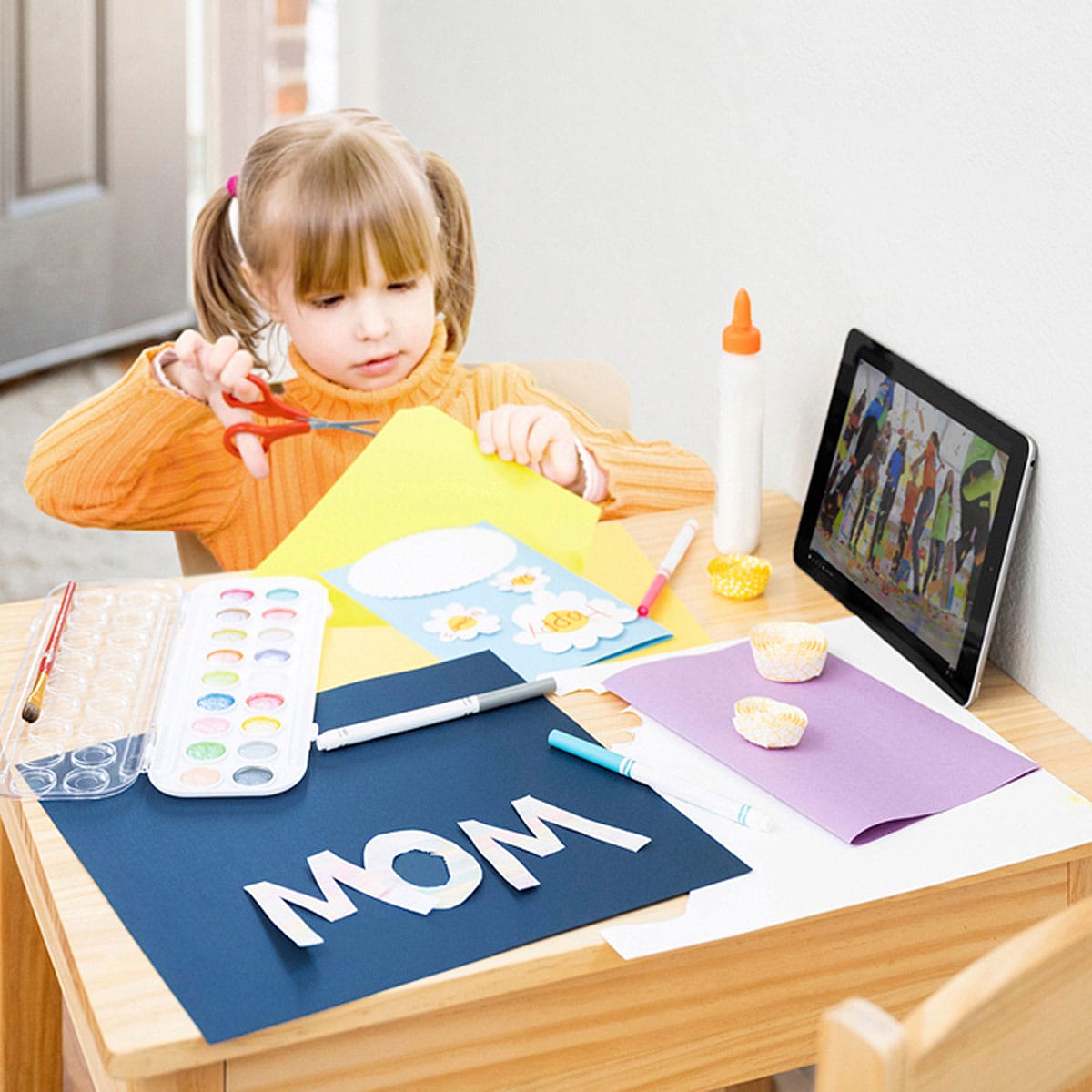 Lifestyle product photography image of a girl making a craft, photoshopped into the scene.