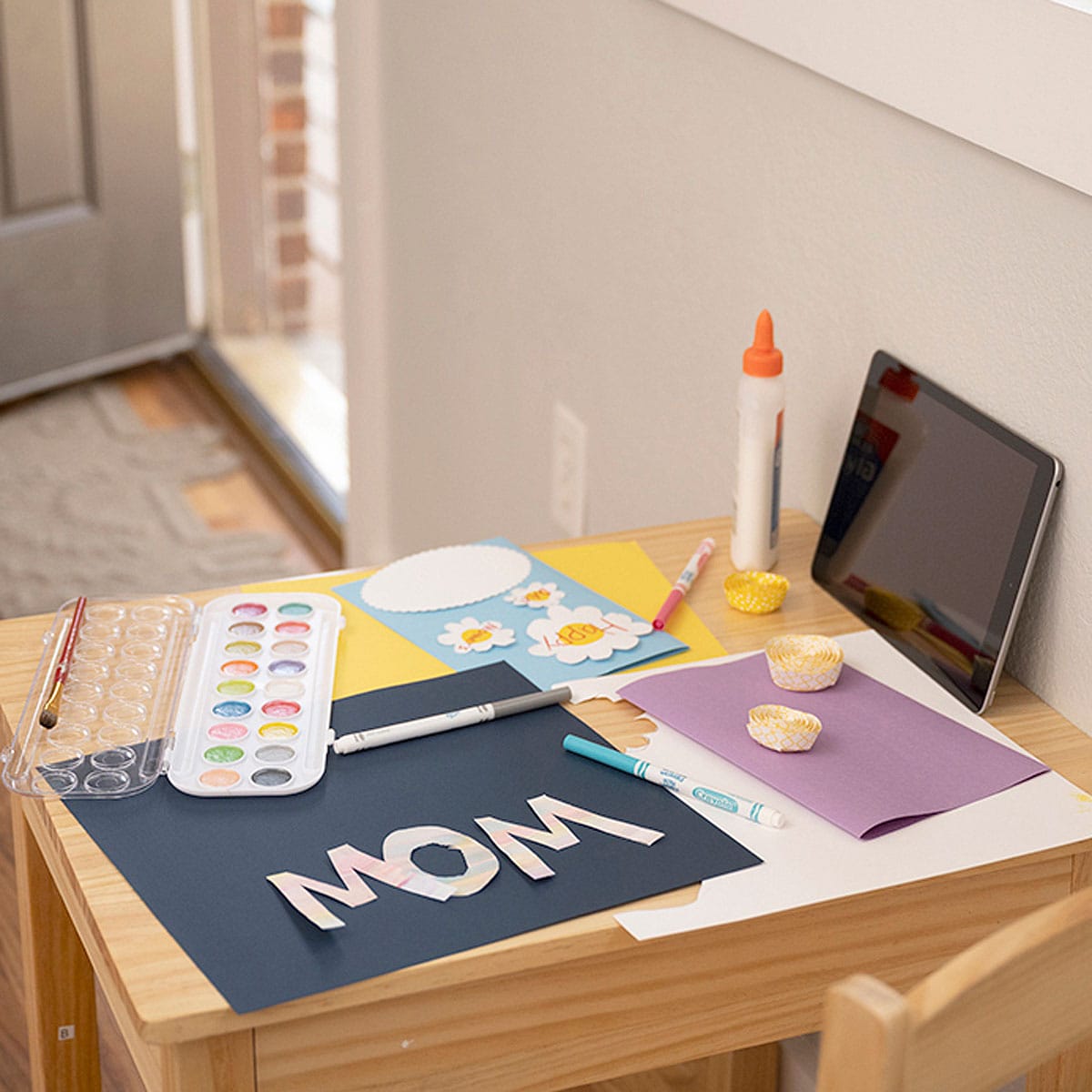 Lifestyle product photography image of a crafting set up for child.