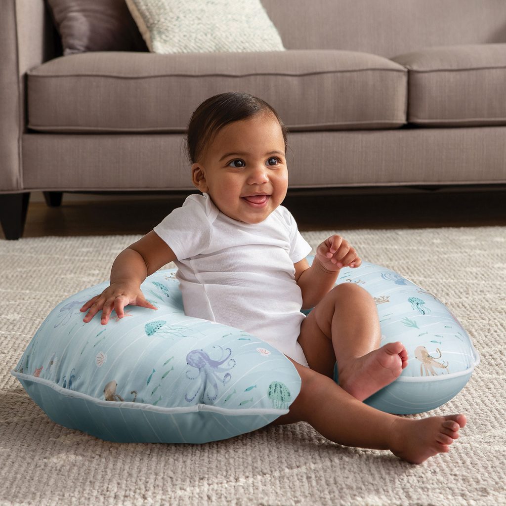 Retouching composite for Bobby showing a new pillow photoshopped into a scene with a baby.