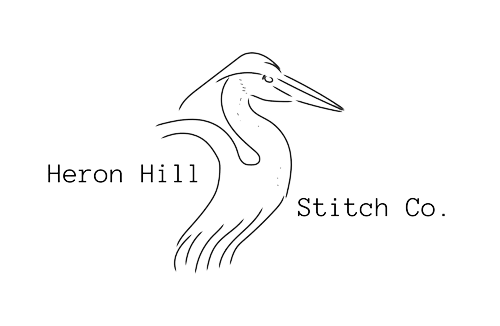 Heron Hill logo with simple pelican illustration line work.