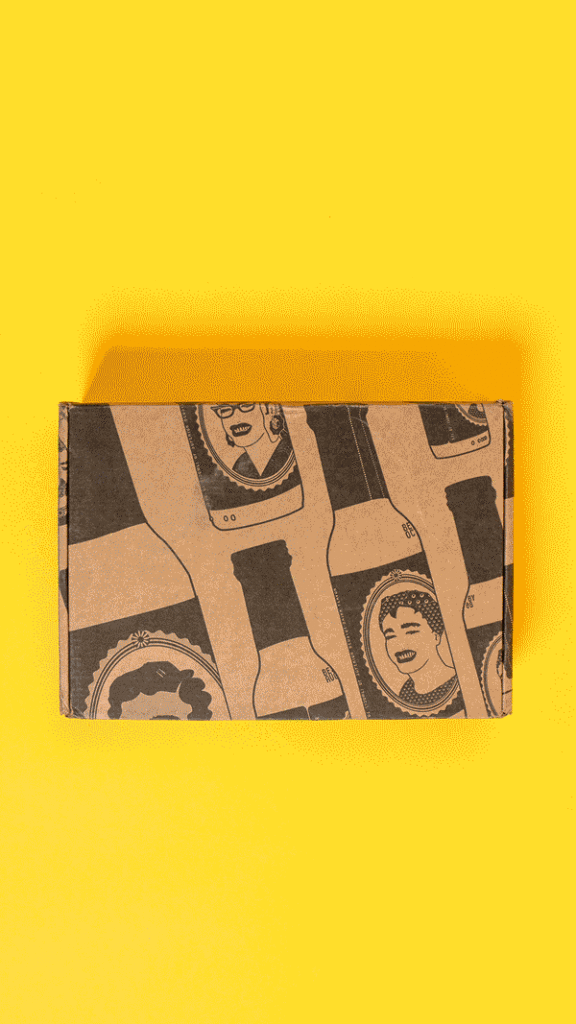 Stop motion gif of hot sauce coming out of box and rolling with peppers dancing around.