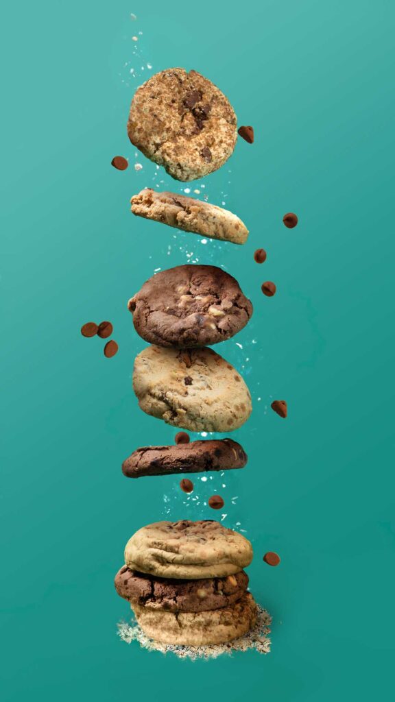 Composite retouching of stack of cookies floating on top of each other as if falling from the sky.