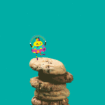 Stop motion gif of illustrated character dancing on cookie stack.