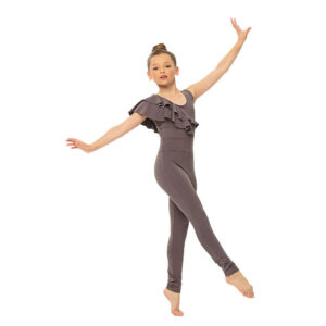 Ballet dancer posed with one foot pointed forward and arms pressed out to sides at an angle.