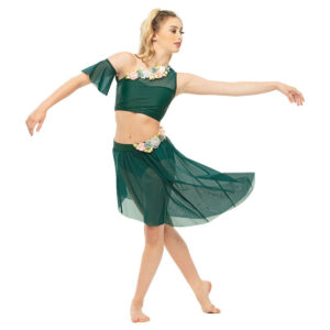 Lyrical dancer posed in b plus with one arm curved out and one dropping skirt in motion.