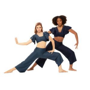Contemporary dancers posed in a deep lunge with one arm pressed out and one reaching out to the side.
