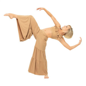 Contemporary dancer in a back arch with one leg bent and lifted, arms reaching out to the sides.