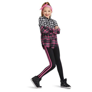 Hip hop dancer posed leaning on back leg with arms crossed.