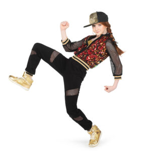 Hip hop dancer pressed back on one foot with other flexed in front, arms in a running pose.