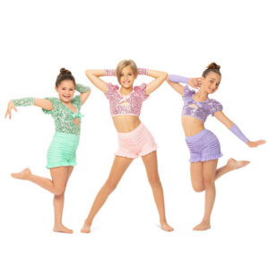 Group jazz pose with one in center and hands on head and one on either side with hand on head and other hand pressed to the side. The two on the sides have one foot flexed behind.
