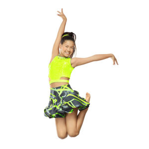 Jazz dancer doing a tuck jump with one hand reaching above their head and one to the side.