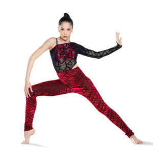 Jazz dancer posed in a deep lunge with weighted leg popped, one arm leaning on bent knee and other flexed to the side.