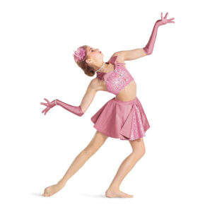 Theater dancer posed in a lunge with arms to the side with outstretched hands and bent elbows while they look up toward the sky.