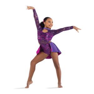 Jazz dancer posed with one foot popped and arms outstretched with a bend in the wrist, one above their head and one to the side.