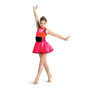 Jazz dancer posed in a crossed fourth position and arms pressed upward, one to the side and one above their head.