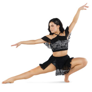 Jazz dancer posed in a squat on popped foot and other leg out stretched and pointed, one arm elegantly raised above head and one to the side.