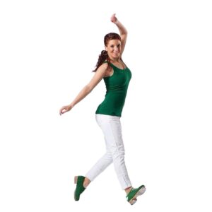 Tap dancer posed in a riff stand with weight on one heel and one toe with arms out casually.