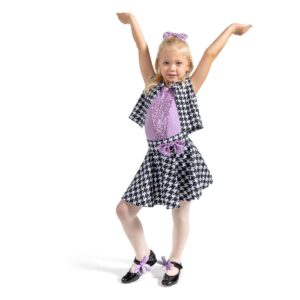 Young dancer posed with hands flexed upward toward the ceiling and one foot popped.