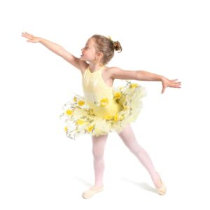 Young dancer posed in arabesque while looking up toward hand.