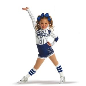 Young dancer posed with feet apart and hip pushed to the side with and one hand on hip and one flexed and raised above their head.