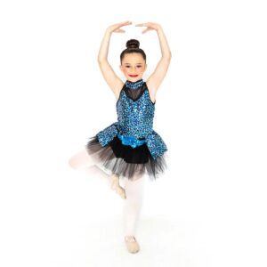 child ballet dance pose in sequin tutu