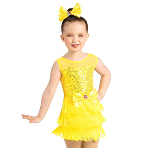 child jazz dance pose in yellow flapper costume