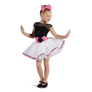 child tap dance pose in polka dot outfit