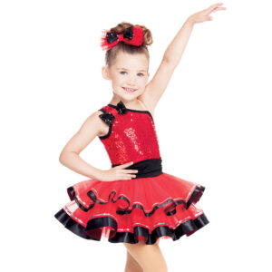 child holding ballet dance pose in red tutu