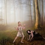 High end composite of elves dancing in the forest.