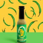 E-commerce product shot of Shaquanda's hot sauce with green pepper pattern illustrated behind it.