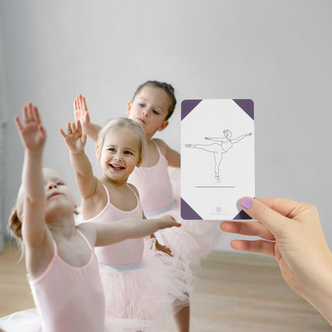 Dance Ed Tips card held up in front of a composited scene of dancers doing the pose depicted on the card