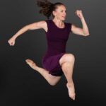 LifeArt Dance company photography of a dancer in a running leap pose.