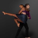 LifeArt Dance company photography of a man carrying a woman mid-leap into his arms.