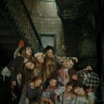 Photo composite of a group of tap dancers from Rocky Mountain Rhythm posed as the undead in a haunted house scene.