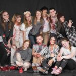 Group of tap dancers from Rocky Mountain Rhythm covered in fake blood ready for their zombie shoot.
