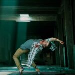 Photo composite of a tap dancer from Rocky Mountain Rhythm posed in a toe stand backward arch as the undead in an abandoned room scene.