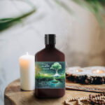 Photo composite of lotion bottle from Melt on a side table with insence and candles.