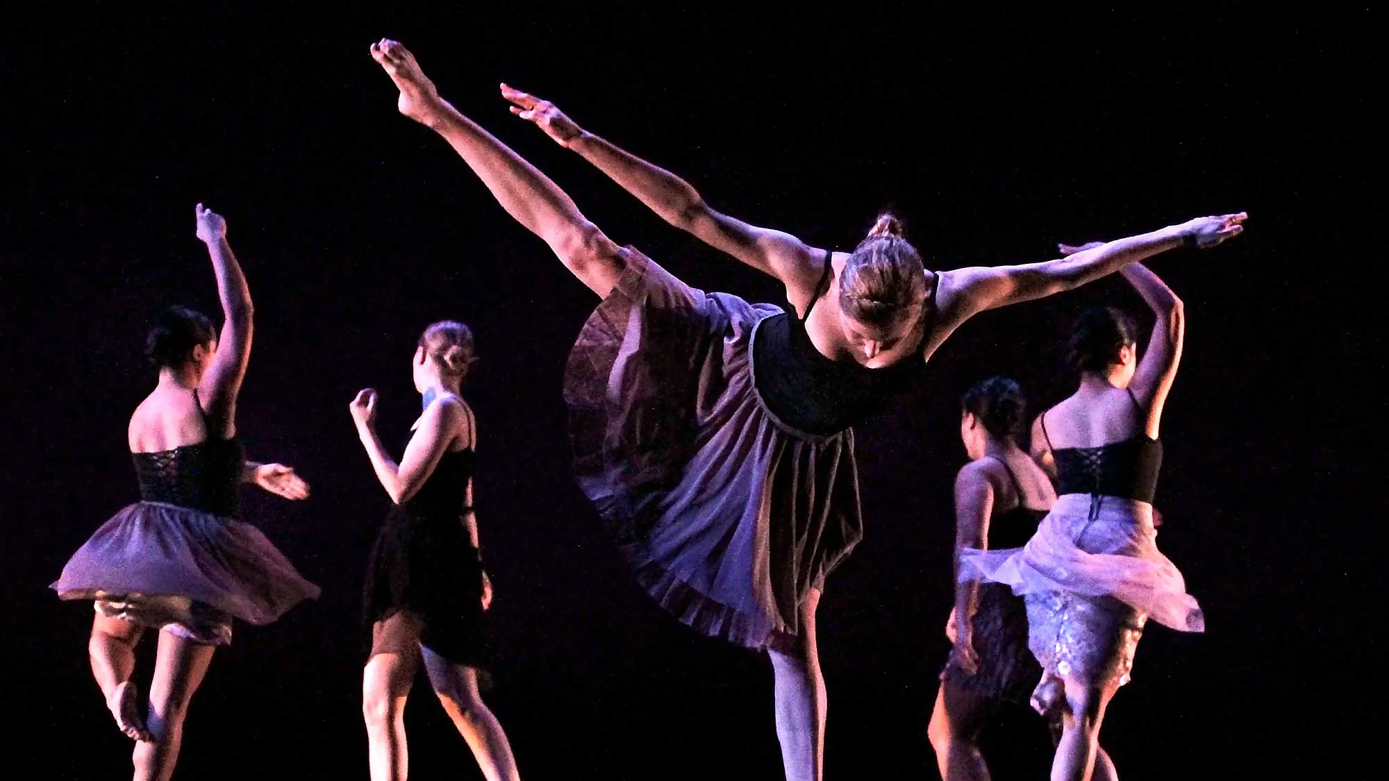 Orchesis company dancers on stage photographed at dress rehearsal