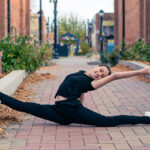 Dancer in a lifted split in downtown Longmont