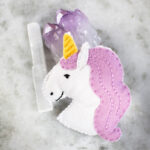 Felt kit of unicorn with crystals on a marble surface