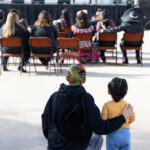 People watching the performers at Dia De Los Muertos