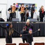 Family dancing to the band at Dia De Los Muertos