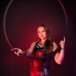 Lyra dancer posed for a headshot with her hoop