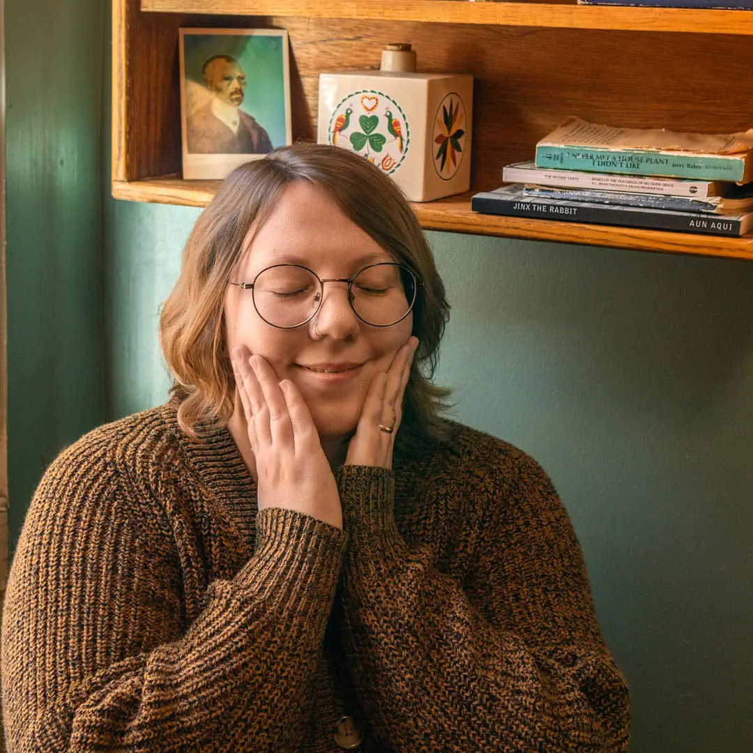 Alex, CEO of Heron Hill, making a pleased face in a quaint coffee shop